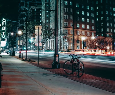 Black bike near the poles
